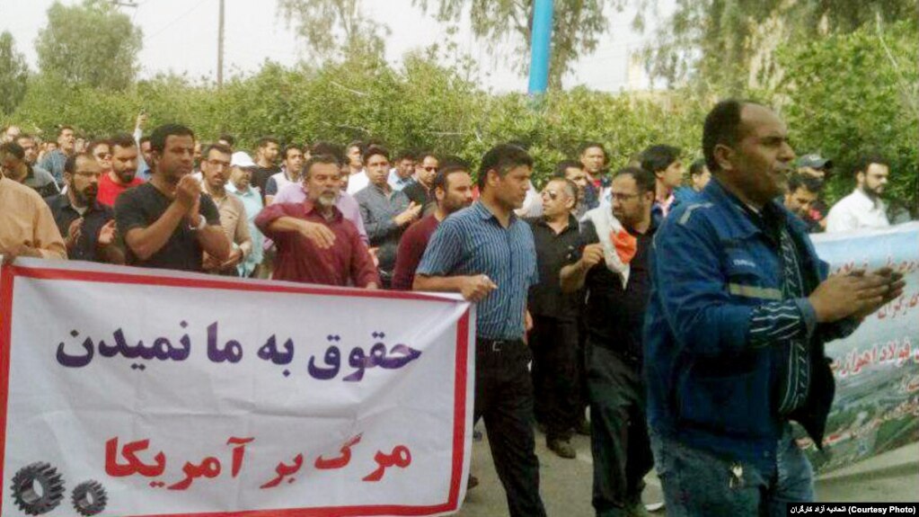 A protest by Iranian steel workers over unpaid wages on March 17, 2018. The banner mocks the regime by saying, "They don't pay us - Death to America".