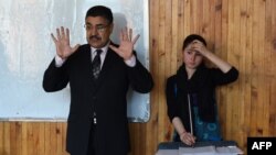 FILE: Afghan Negina Khpalwak (R), the first female orchestra conductor in Afghanistan, during a rehearsal at the Afghanistan National Institute of Music in Kabul in January 2017.