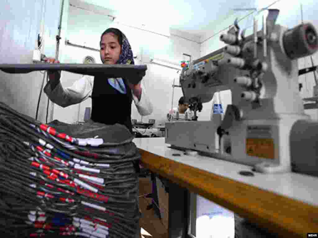 A girl works in a tailor shop in Iran.