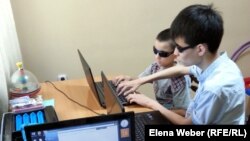 Adil Uralbaev (right), who was born without sight, says the Internet changed everything for him.