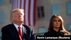 U.S. President Donald Trump and first lady Melania Trump participate in a 9/11 commemoration in Arlington, Virginia. 