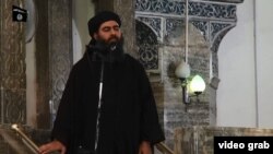 The man purported to be Abu Bakr al-Baghdadi appears in the video