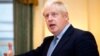 Britain's Prime Minister Boris Johnson gestures as he speaks to members of Britain's military during a reception for the Armed Forces inside 10 Downing Street in Central London on September 18, 2019. 