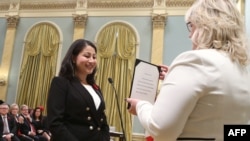 Canada's new Democratic Institutions Minister Afghan-born Maryam Monsef is sworn-in during a ceremony at Rideau Hall in Ottawa on November 4.