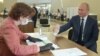 Russian President Vladimir Putin casts his vote at a polling station at the Russian Academy of Sciences on July 1.