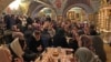 Attendees of the Peter and Fevronia Club mingle at Moscow's Dormition Church.
