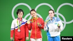 Karina Goricheva, right, of Kazakhstan took home the bronze in the weightlifting event at the Rio 2016 Olympics.