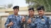 Policemen vote at provincial elections in Basra.