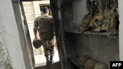 Nagorno-Karabakh -- An Armenian soldier of the self-proclaimed republic of Nagorno-Karabagh leaves a dugout at the frontline on the border with Azerbaijan near the town of Martakert, 06Jul2012