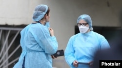 Armenia -- Healthcare workers are seen outside the Nork hospital in Yerevan which deals with most coronavirus cases in Armenia, March 20, 2020.