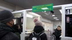 Chinese citizens passing through a temporary corridor opened at a border checkpoint in Russia's Far East between Blagoveshchensk and Heihe.