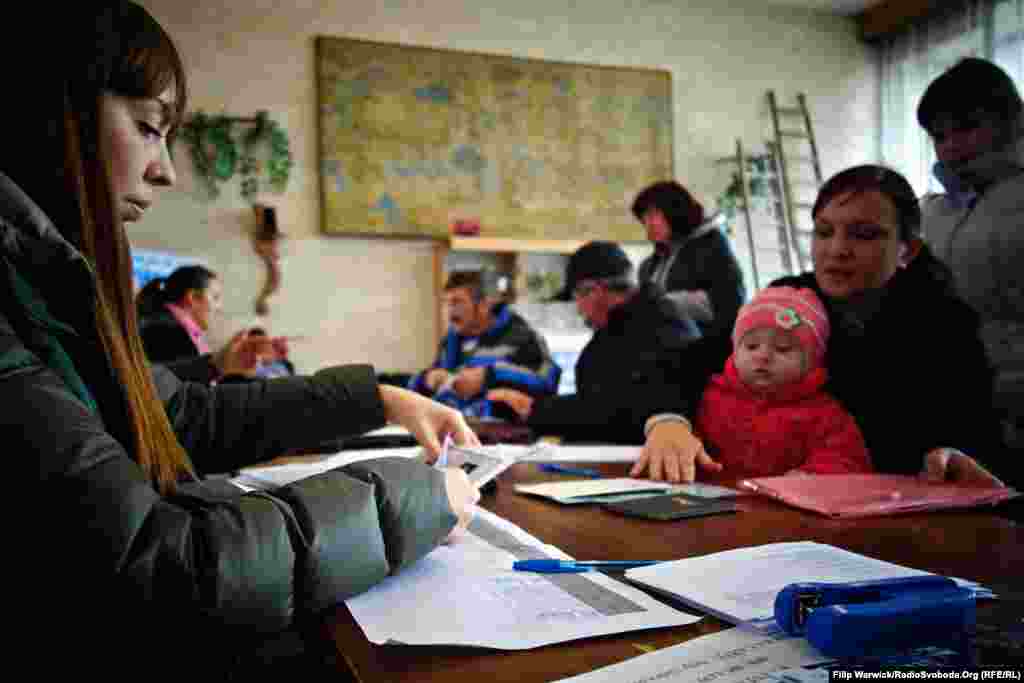 People register for humanitarian aid in Lysychansk.