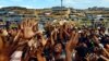 Rohingya refugees from Burma stretch their hands to receive aid distributed by local organizations at the Balukhali makeshift refugee camp in Cox&#39;s Bazaar, Bangladesh. (Reuters/Danish Siddiqui)