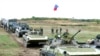 Russia Pulls Back Troops, Georgia Demands More