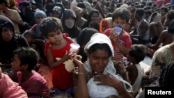 O femeie migrantă Rohingya refugiată în Indonezia