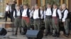 A Serbian male choir performs traditional folk songs. 
