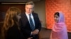 Former British Prime Minister Gordon Brown stands between Malala Yousafzai (right) and Farah Haddad, a Syrian student living in the United States, in New York in September.