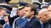 Макрон и Ле Пен пришли на похороны полицейского, убитого в центре Парижа