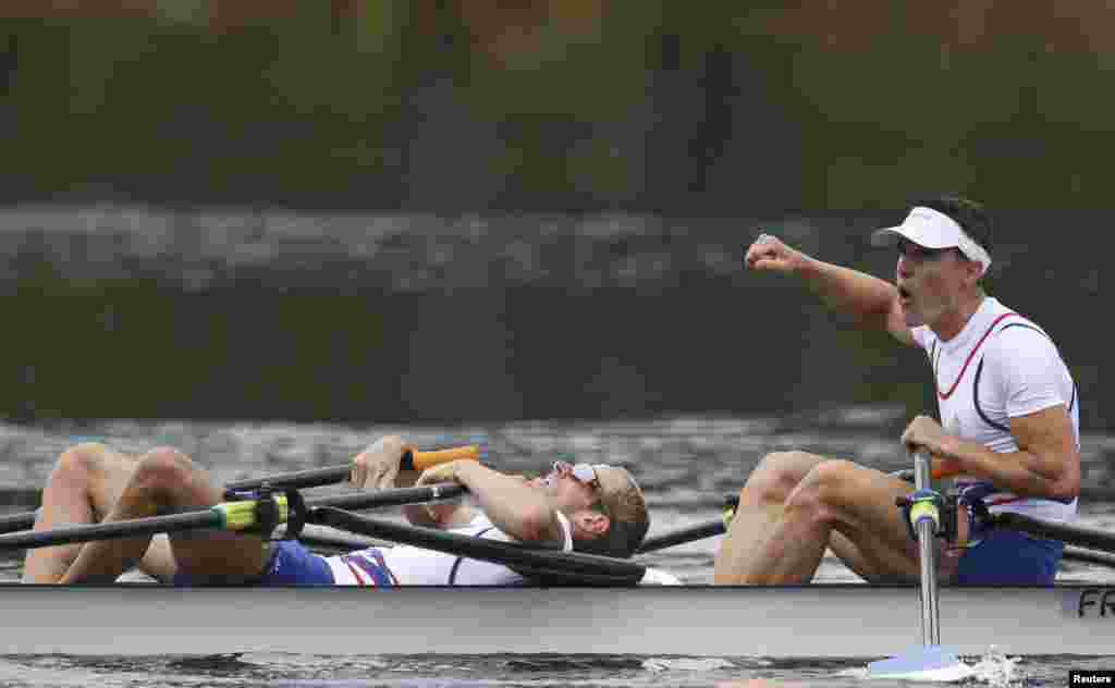 Pierre Houin and Jeremie Azou of France react to winning the gold medal in the lightweight men&#39;s double sculls final.