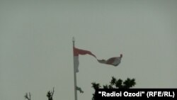 Tajik national flag ripped due to heavy wind. 02.06.2013