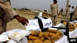 A pile of drugs is displayed in Milak, Iran near the country's border with Afghanistan.