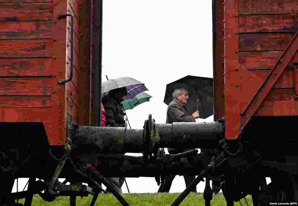 Attendees pass by an old train that was used for deportations of prisoners to the World War II extermination camp in Jasenovac during a memorial ceremony on April 12 for the tens of thousands of victims who were killed there. (AFP/Denis Lovrovic)