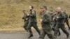 Президент Грузии Михаил Саакашвили (впереди) держит себя в хорошей военной форме