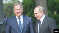 Russian President Vladimir Putin (right) and Finnish President Sauli Niinisto meet outside of Kultaranta castle in Naantali, Finland, on July 1.