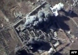An image taken from footage made available by the Russian Defense Ministry purporting to show air strikes carried out by the Russian Air Force on what Russia says was an Islamic State training camp in Idlib Province.