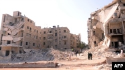 Уруштан бузулган Алеппо шаарынын бир көрүнүшү. 