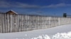 A stanza of the Soviet hymn from the late Stalin period is written on the wall facing museum visitors as they enter from the prison guard headquarters.