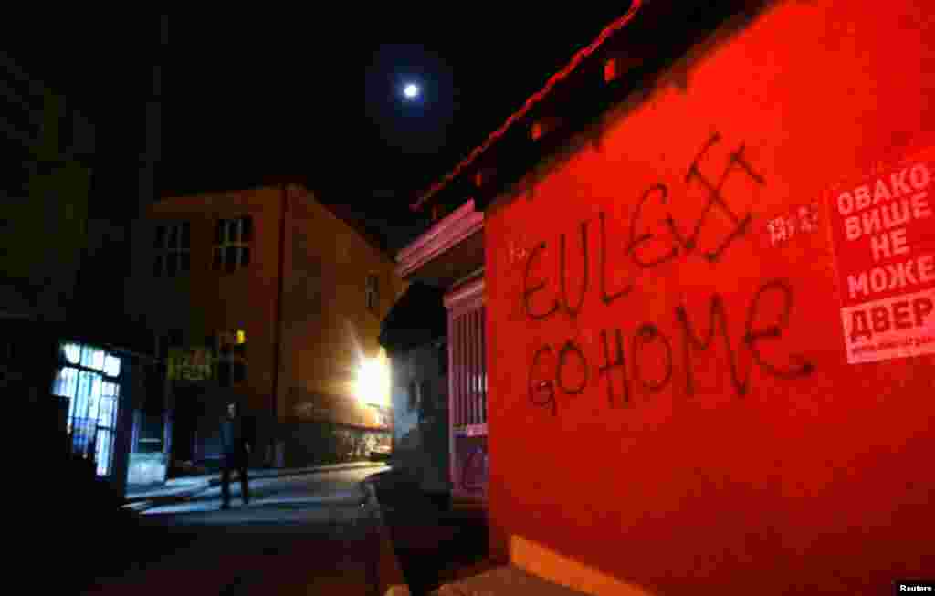 A spray-painted slogan reads, "Eulex go home," referring to the EU police mission in Kosovo.