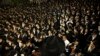 Ultra-Orthodox Jewish men attend a demonstration near recruitment offices in Jerusalem against plans to enlist men from their community into the military. (AFP/Daniel Karmann)