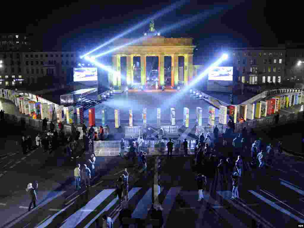 The Brandenburg Gate in Berlin is surrounded by giant dominoes that were toppled on November 8 to commemorate the fall of the Berlin Wall 20 years earlier.