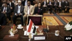 The seat of the Syrian representative at the Arab League is seen empty during a foreign ministers meeting in Cairo on February 12.