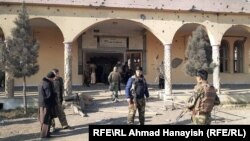 Soldiers patrol near a mosque next to Bagram that was damaged by the attack on December 11.