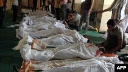 Egyptians in a mosque mourn some of those killed in the military crackdown in Cairo on August 16.