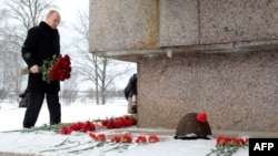 Russian President Vladimir Putin lays flowers at the war memorial Nevsky Pyatachok, the site of one of the most critical and costly campaigns in the siege of Leningrad, on January 27.
