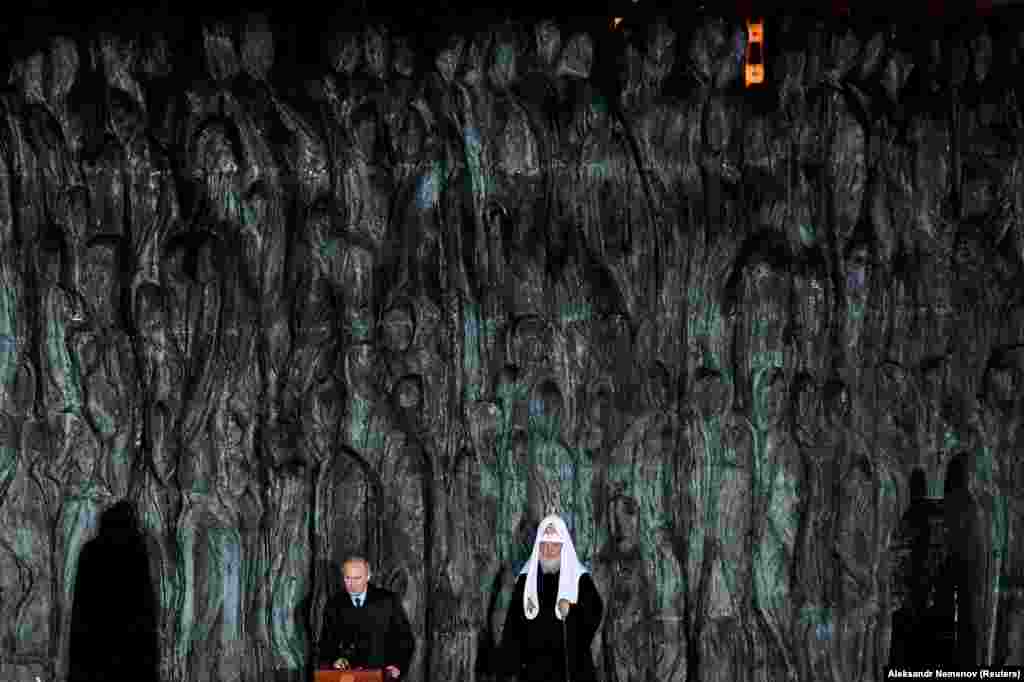 Russian President Vladimir Putin (left) and Patriarch Kirill, the head of the Russian Orthodox Church, attend a ceremony unveiling the country's first national memorial to victims of Soviet-era political repressions, called The Wall Of Grief, in Moscow. (Reuters/Alexander Nemenov)
