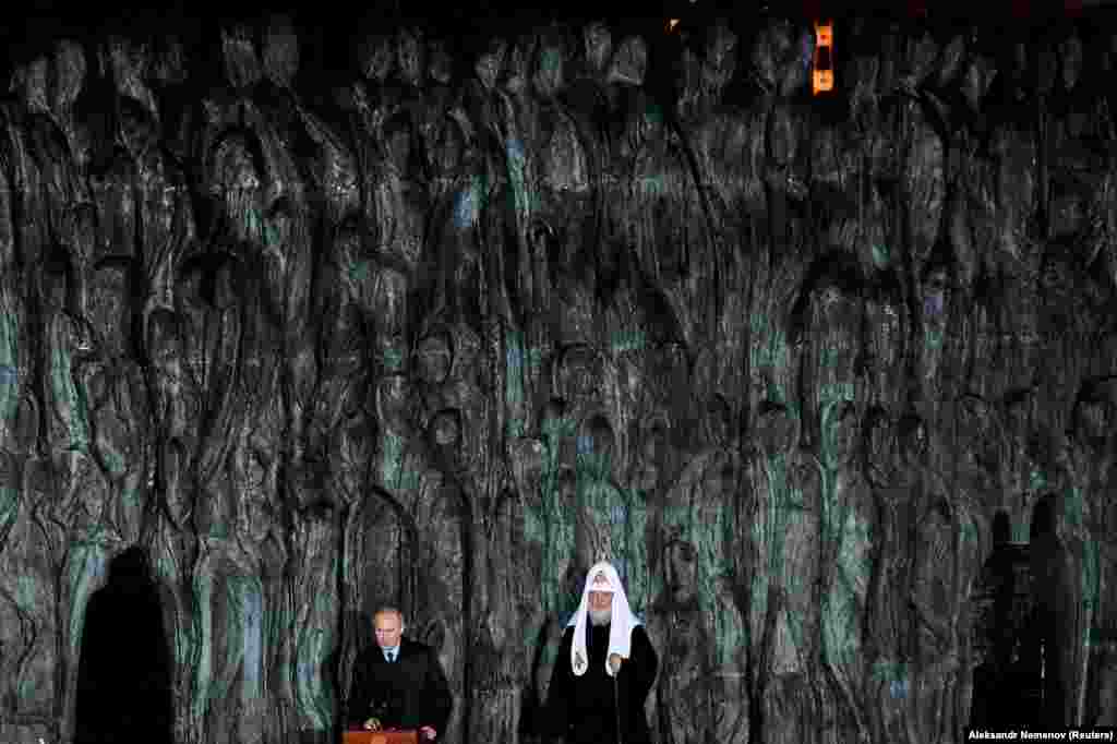 Russian President Vladimir Putin (left) and Patriarch Kirill, the head of the Russian Orthodox Church, attend a ceremony unveiling the country&#39;s first national memorial to victims of Soviet-era political repressions, called The Wall Of Grief, in Moscow. (Reuters/Alexander Nemenov)