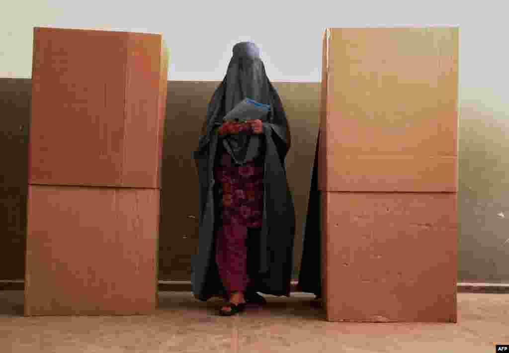 A woman votes at a polling station in Herat in the 2010 parliamentary elections, the fourth effort at democratic polls since the UN-backed Islamic Republic of Afghanistan was founded after the Taliban ouster.