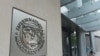 The seal of the International Monetary Fund is seen on a headquarters building in Washington