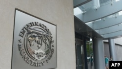 The seal of the International Monetary Fund is seen on a headquarters building in Washington