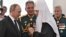 Patrijarh Ruske pravoslavne crkve Kiril smatra se bliskim savetnikom predsednika Vladimira Putina. Pored njih je bivši ministar odbrane Sergej Šojgu.