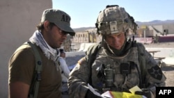 Staff Sergeant Robert Bales (right) at the National Training Center in Fort Irwin, California in August 2011.