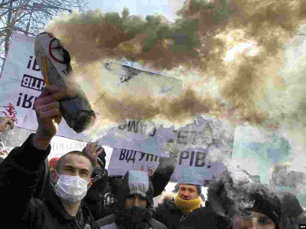 Students create a disturbance in front of Ukraine's parliament building to protest a bill to raise tuition fees. Photo by Sergey Dolzhenko for epa