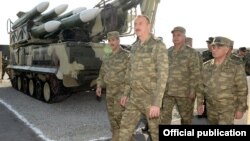 Azerbaijan - President Ilham Aliyev inspects weapons put on display at the site of exercises held by the Azerbaijani army, 26Jun2014.