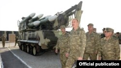 Azerbaijan - President Ilham Aliyev inspects weapons put on display at the site of exercises held by the Azerbaijani army, 26Jun2014.