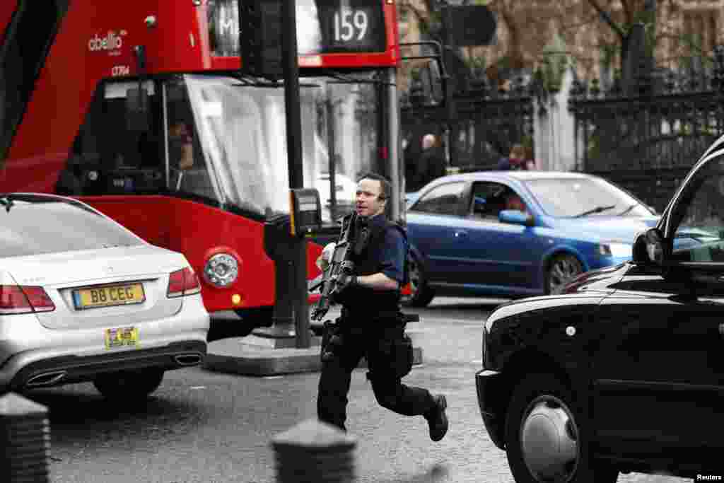 An armed policeman outside parliament