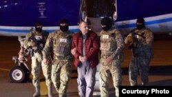 Russian-Israeli blogger Aleksandr Lapshin is collected by Azerbaijani security forces upon his arrival in Baku on February 7. 